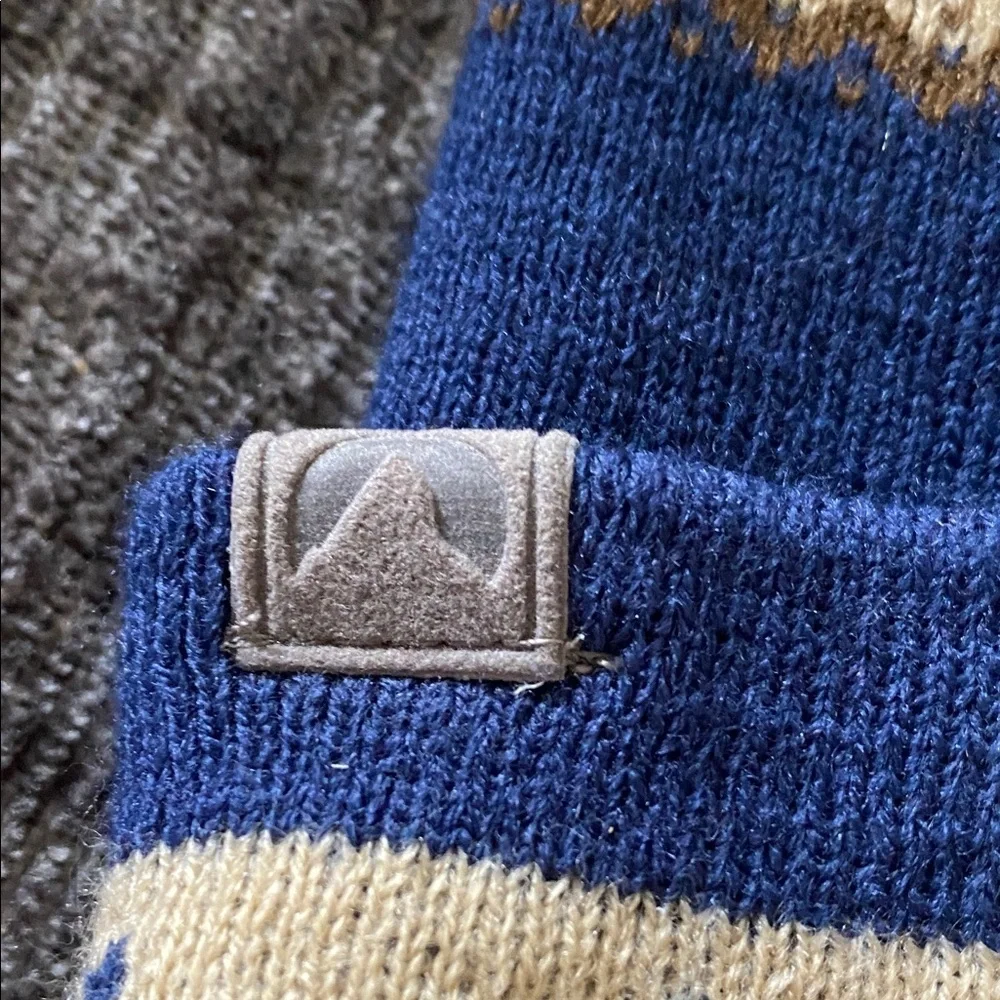 Cirque Blue and Tan Beanie with Colorado Patch. Designed in Vail, CO.